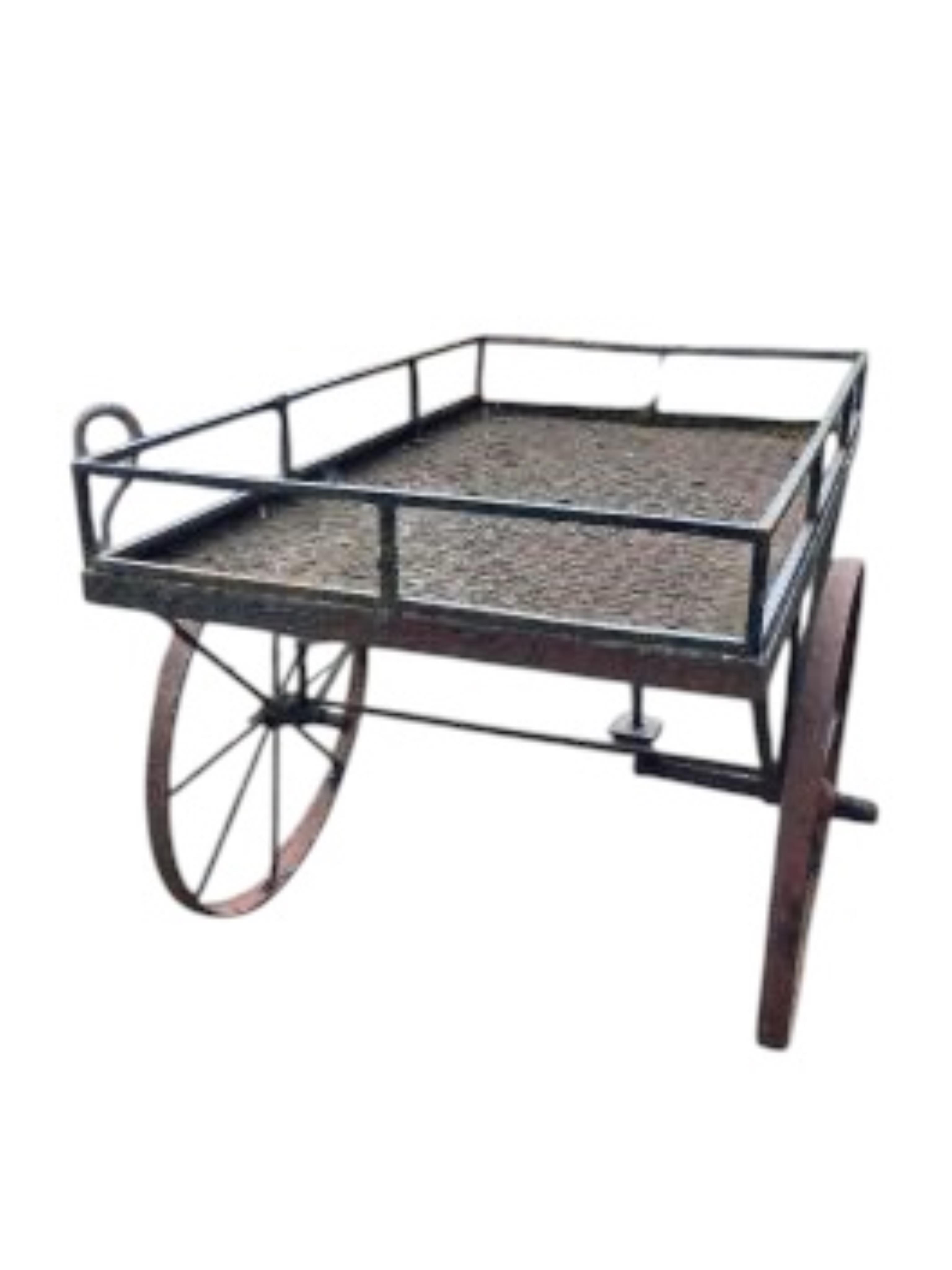 A wrought iron garden barrow, width 76cm, length 152cm, height 106cm